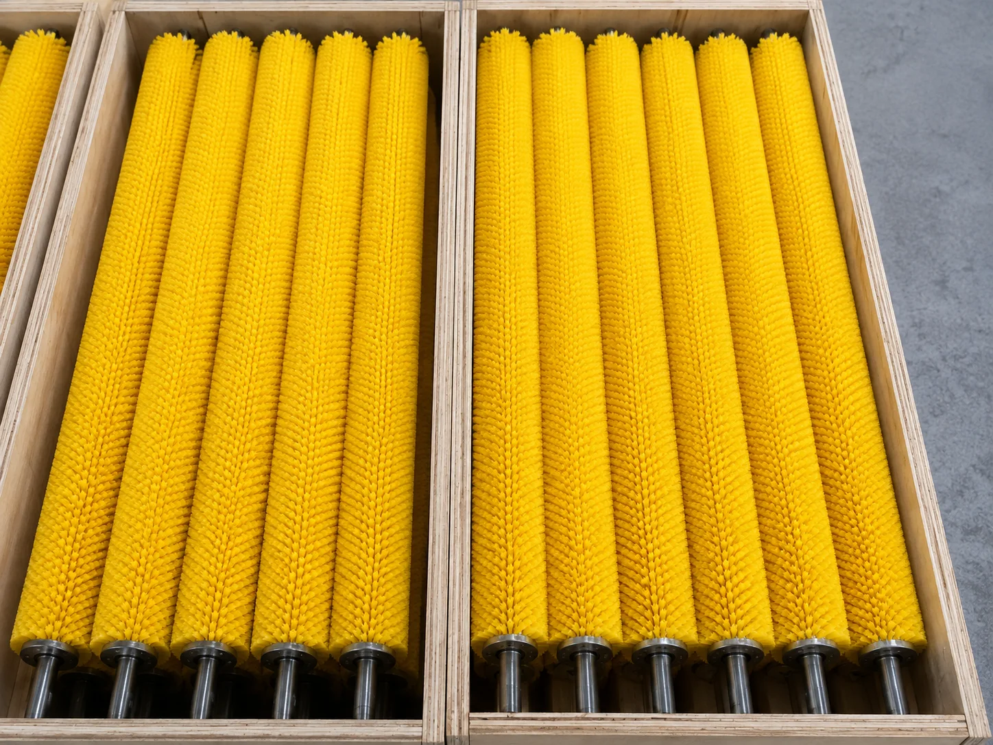 Custom industrial roller brushes arranged in wooden cases for shipment