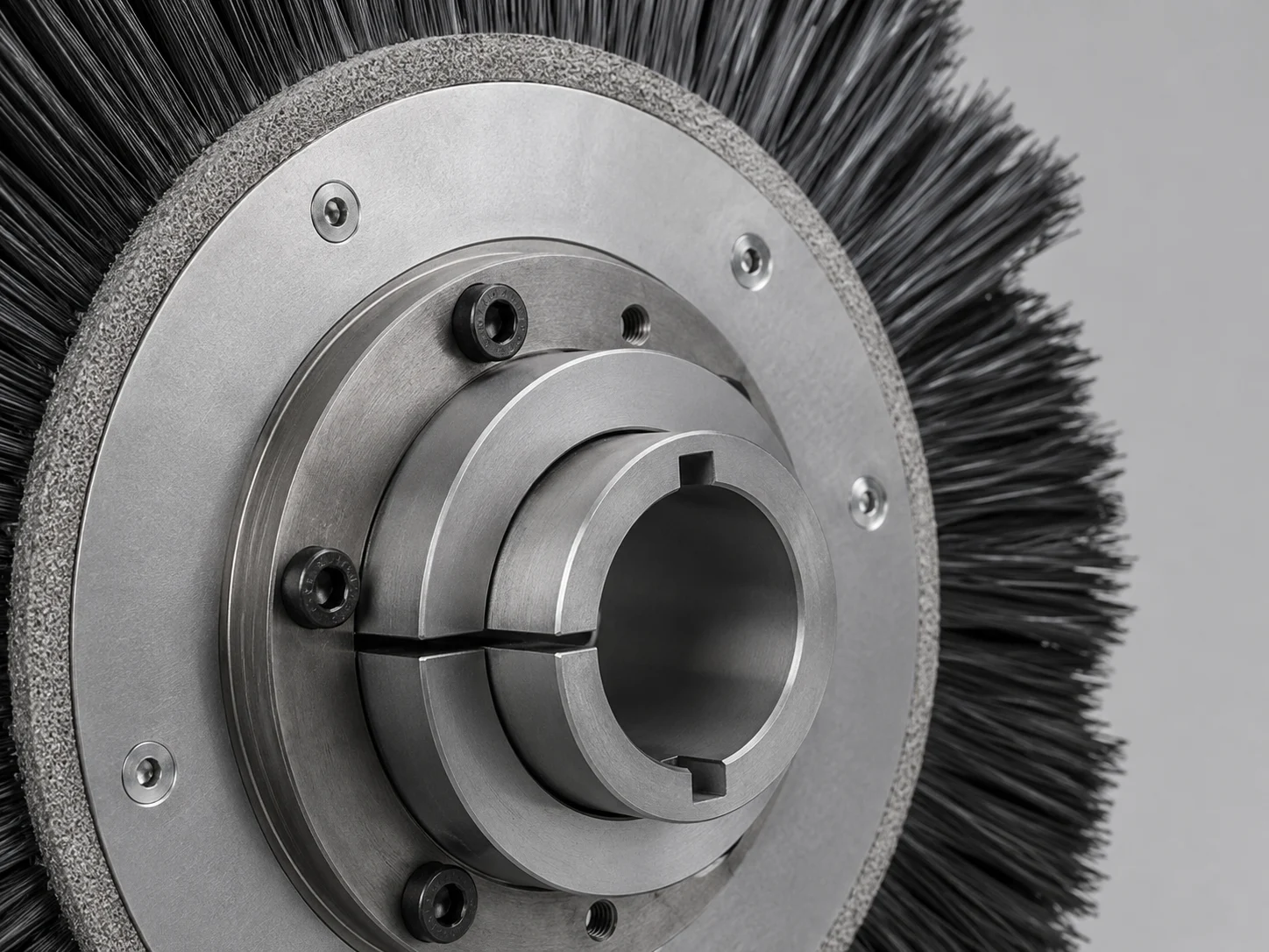 Hub-mounted disc brush with a custom mounting interface