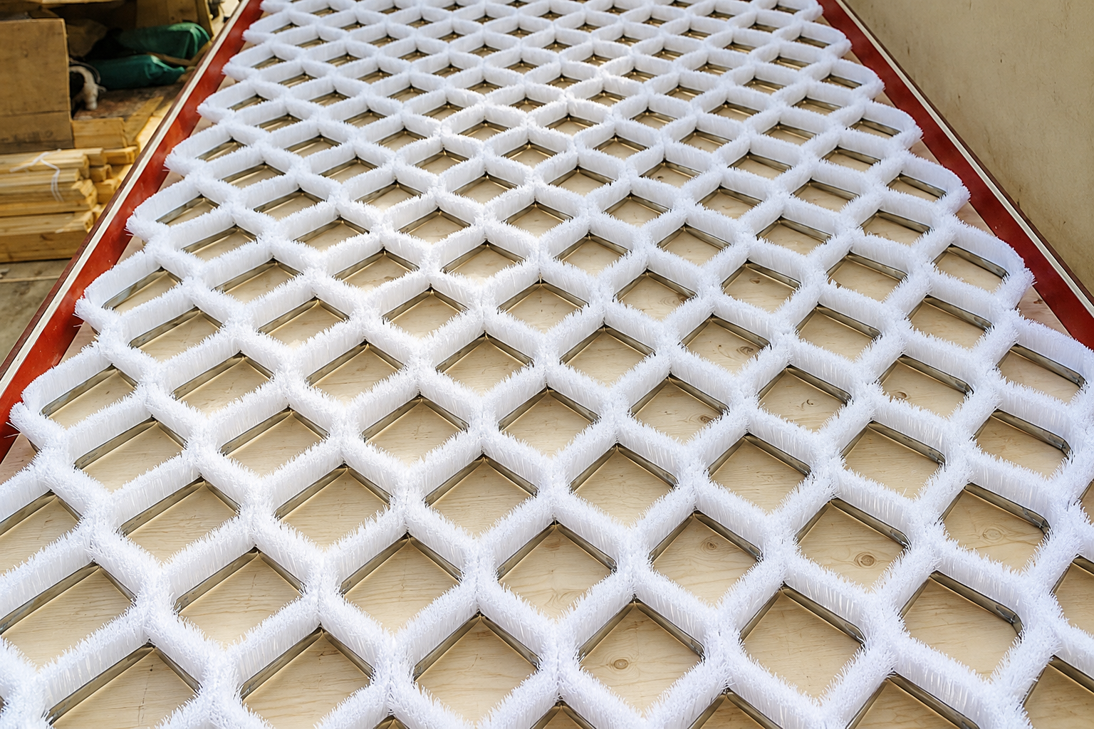 Finished flexible dry ski slope bristle mat with a diamond lattice pattern