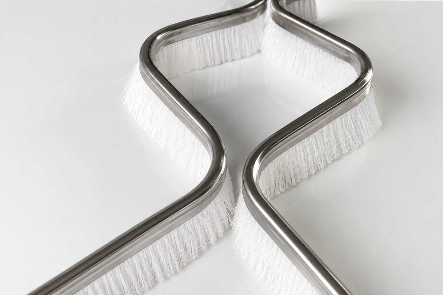 Formed PBT channel strip brushes for dry ski slope matting