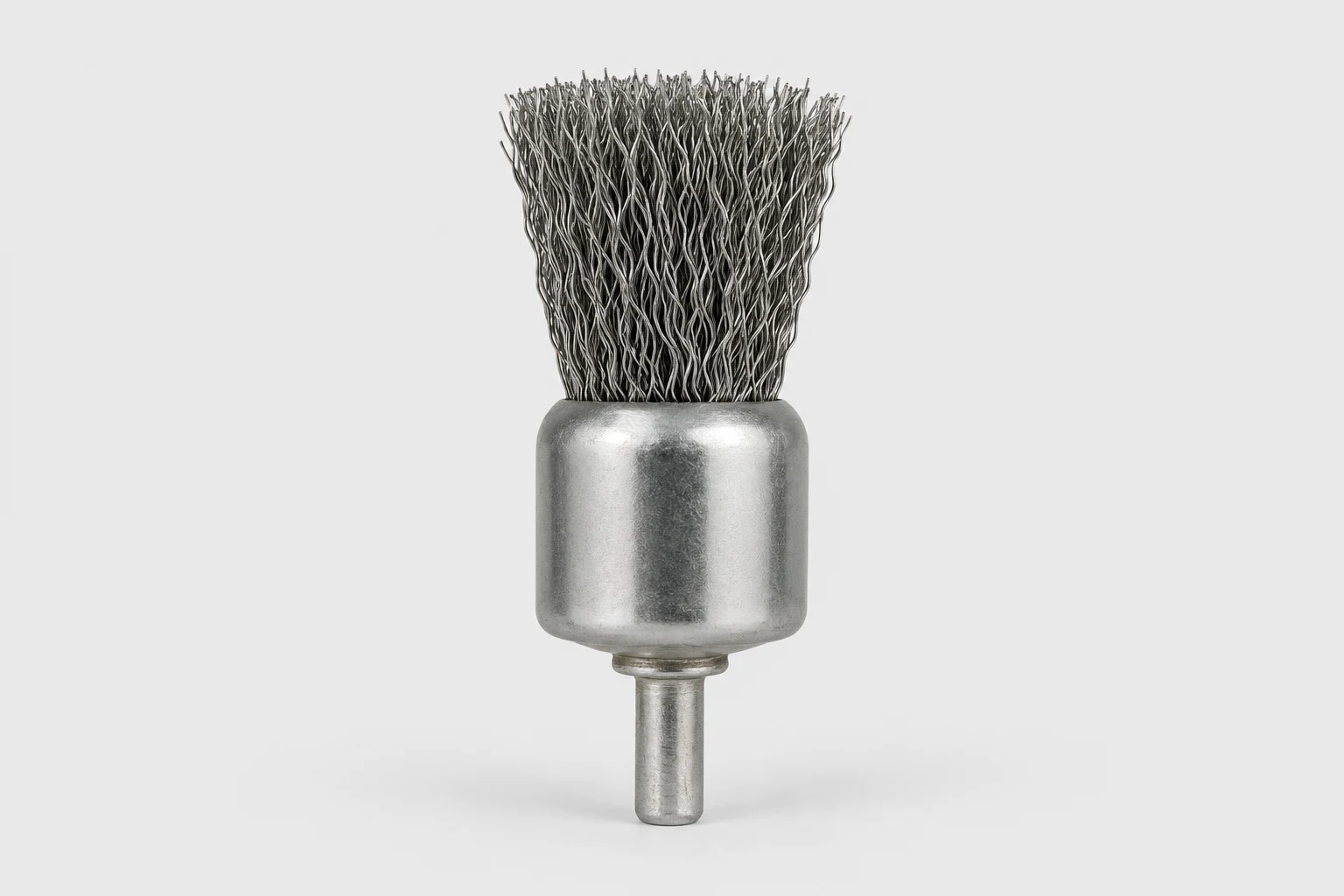Crimped wire end brush on a plain background