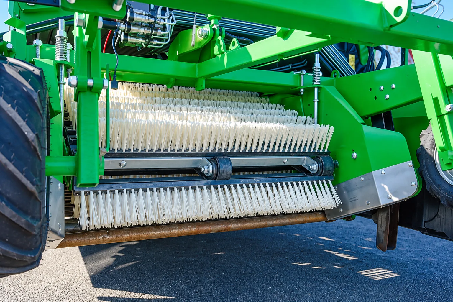 Lath and plate brushes installed in agricultural harvesting machinery for crop cleaning and handling