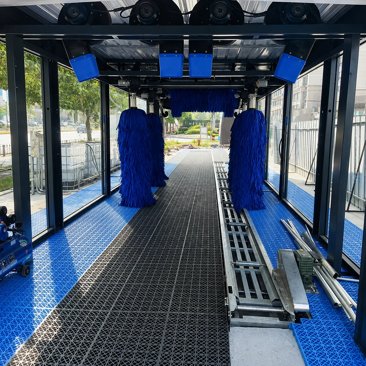 Brush assembly for a tunnel and conveyor automatic car wash system