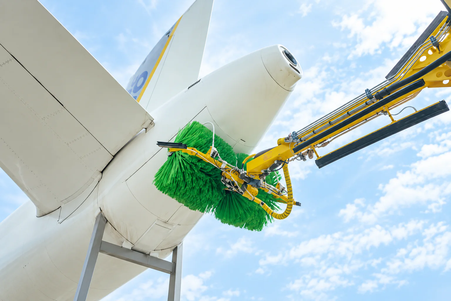 Large soft roller brush on automated aircraft exterior washing equipment
