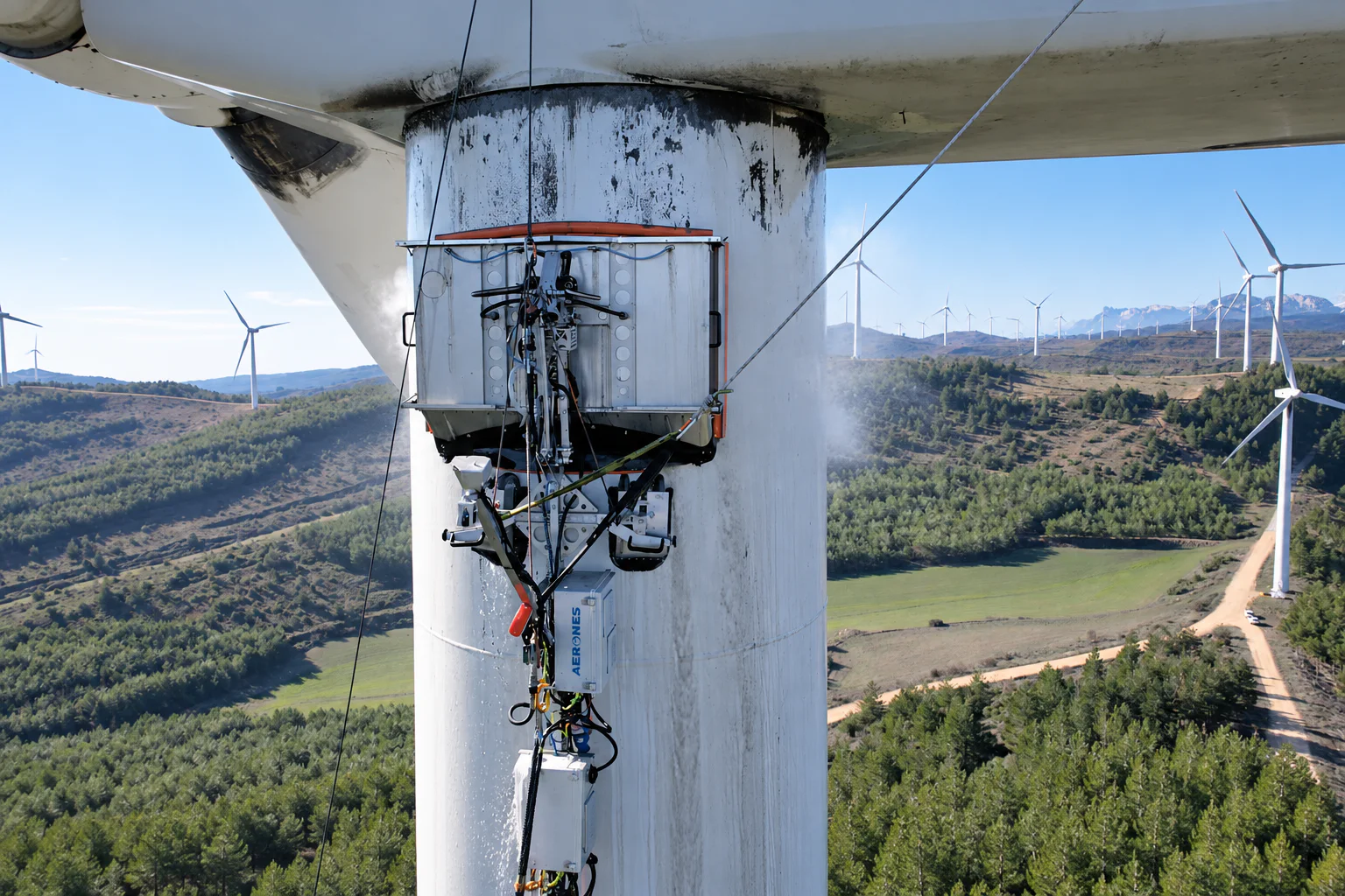 Robotic cleaning equipment operating on a wind turbine tower
