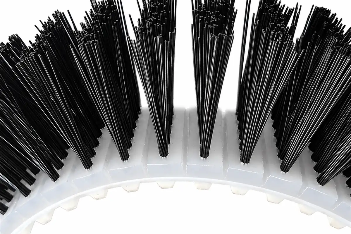 Close-up of a flexible conveyor belt brush used for product control and guided contact