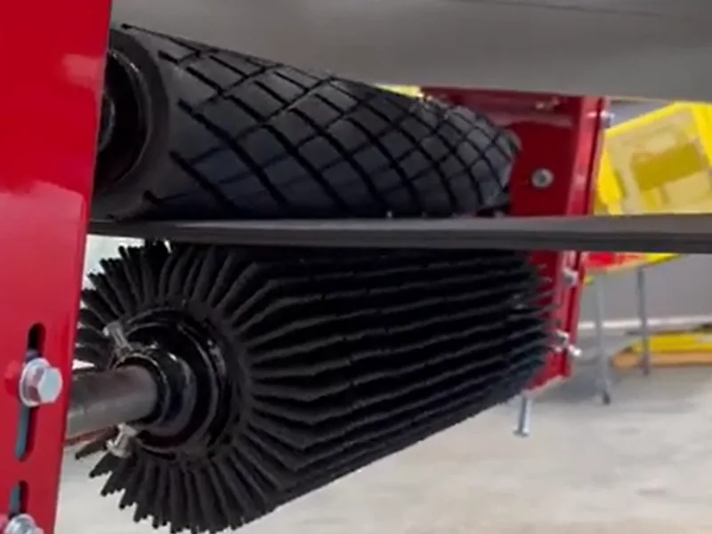 Conveyor belt cleaning roller brush module mounted under a belt