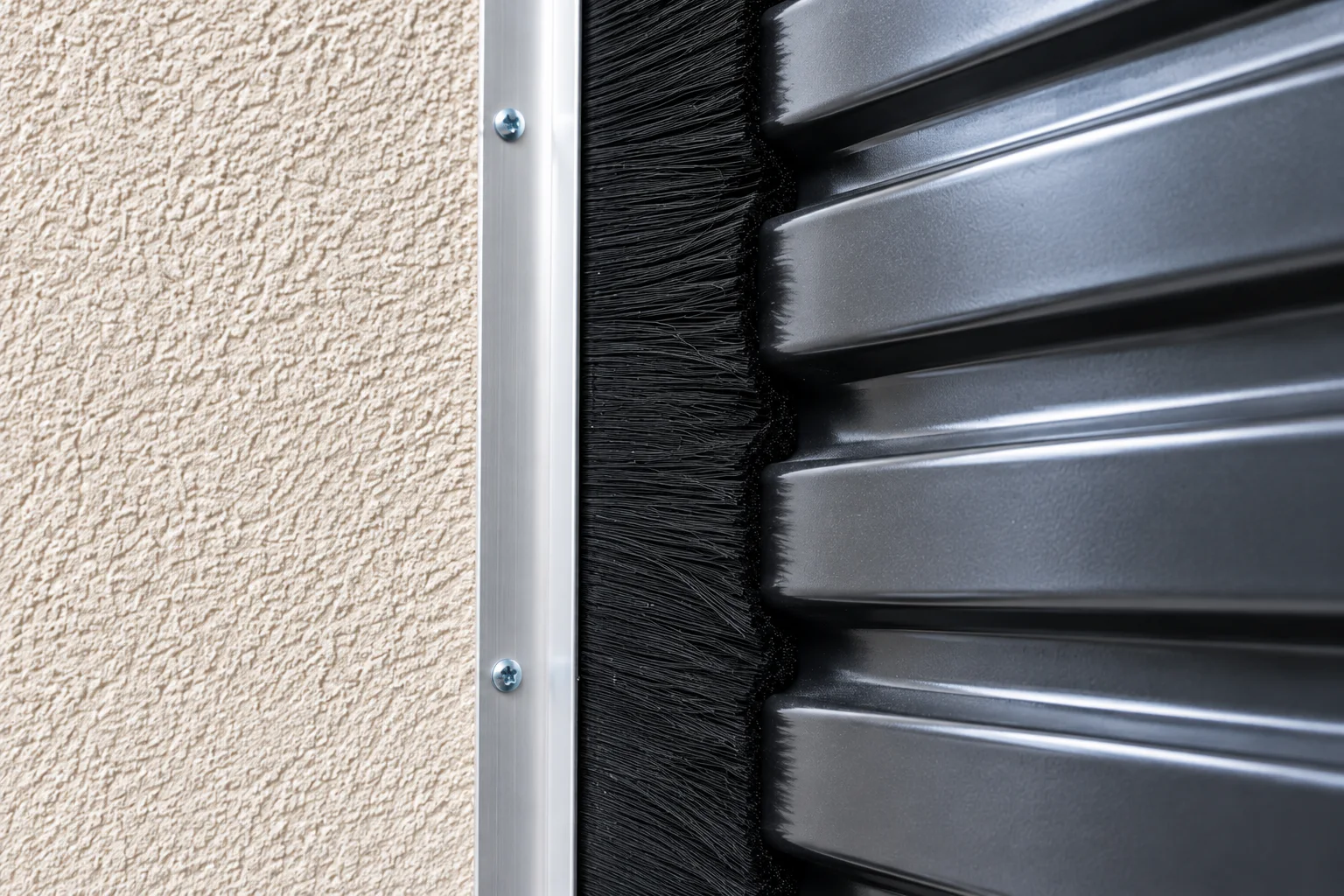 Close-up of a side brush seal contacting a corrugated roll-up door