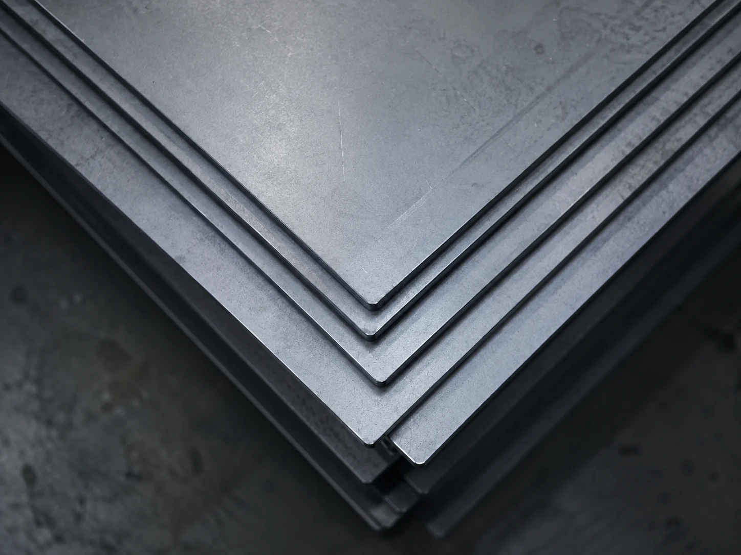 Industrial brush and metal component representing metal processing applications