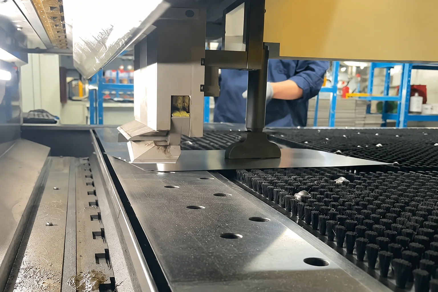Sheet metal supported on a panel brush table for press-brake handling
