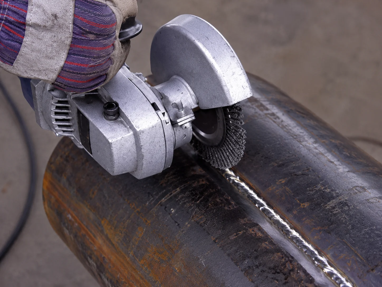 Close-up of a brush application for weld cleaning and preparation