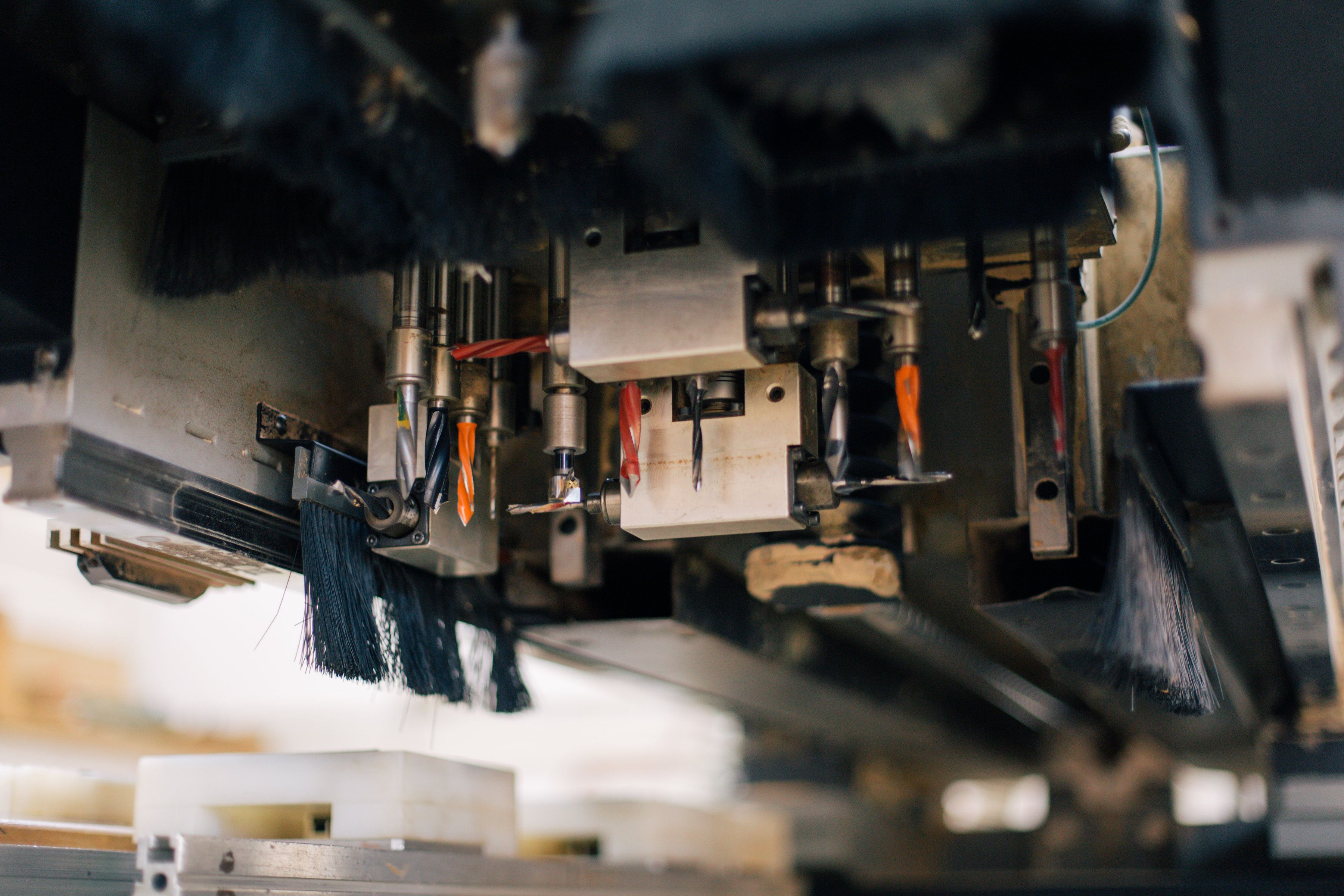 Strip brush guiding cartons and containers in packaging equipment