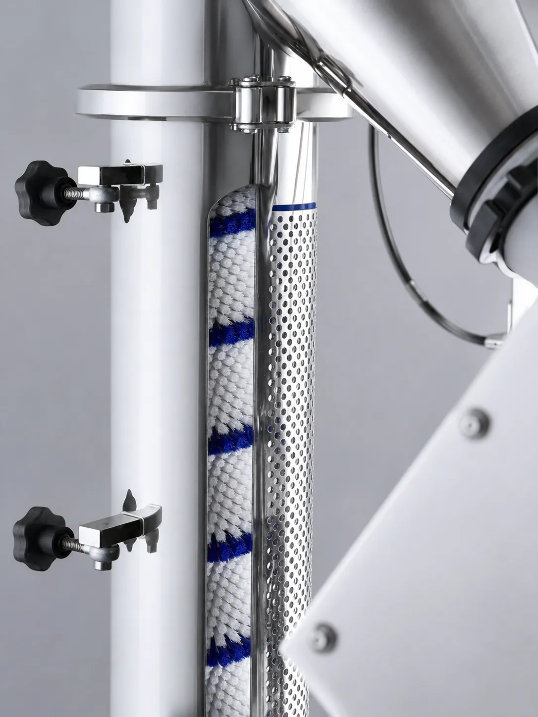 Pharmaceutical pill mover brush installed inside controlled processing equipment
