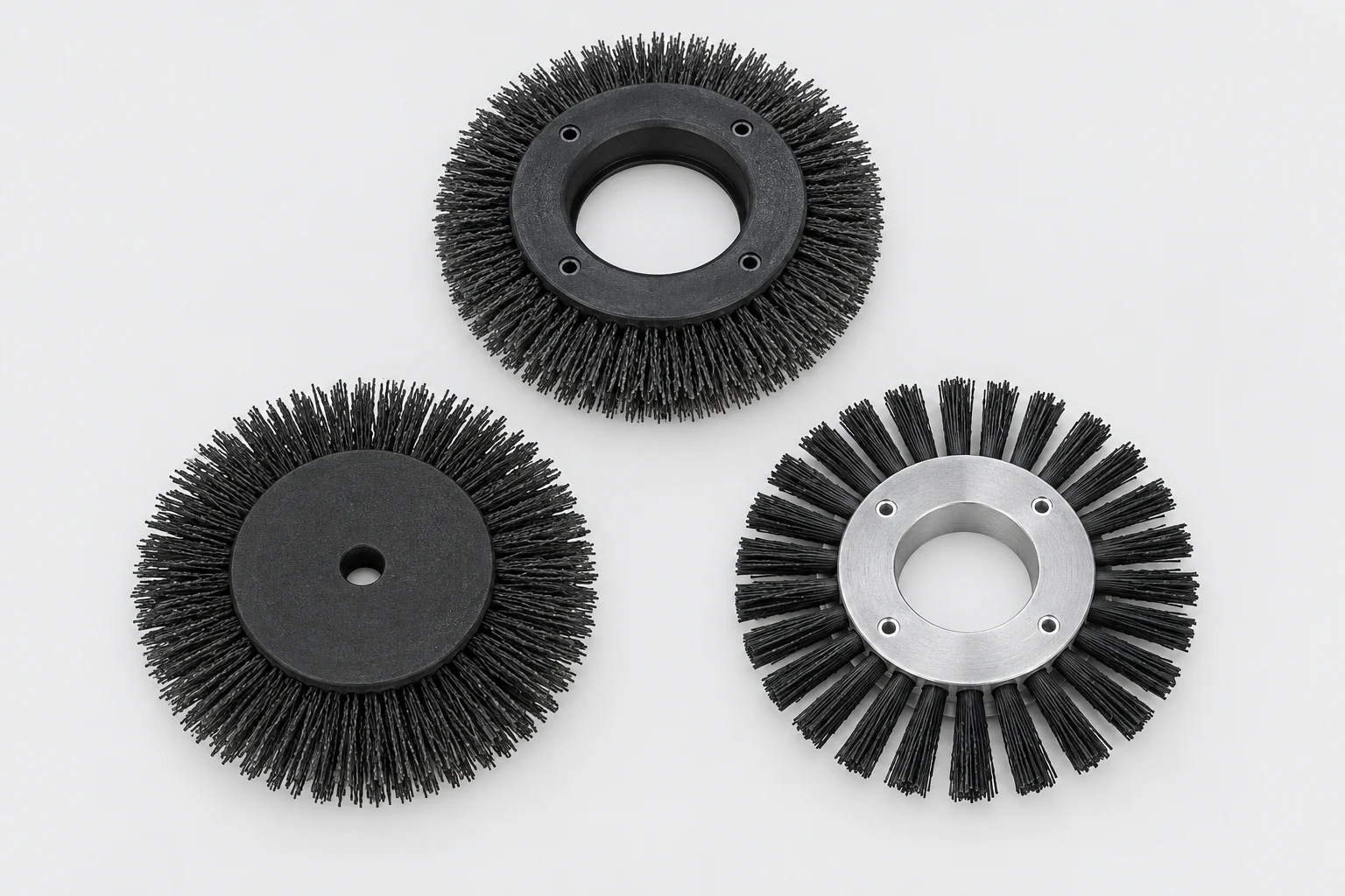 Three radial brush discs with different mounting hubs and bristle arrangements