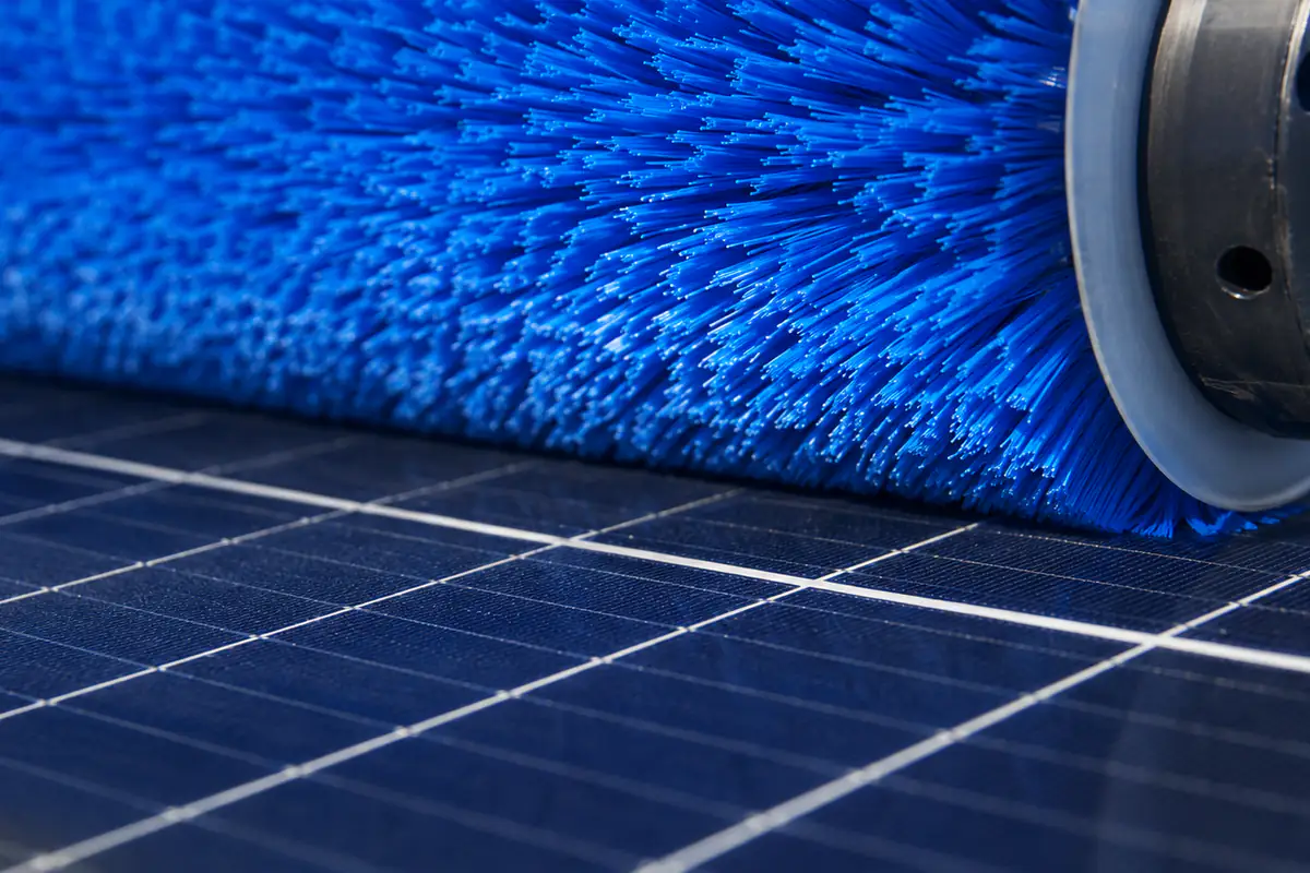 Soft synthetic cylinder brush filaments contacting a solar panel surface