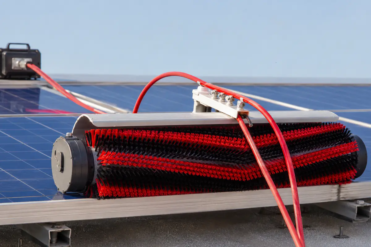 Cylinder brush mounted on a solar panel cleaning system with visible drive and support details