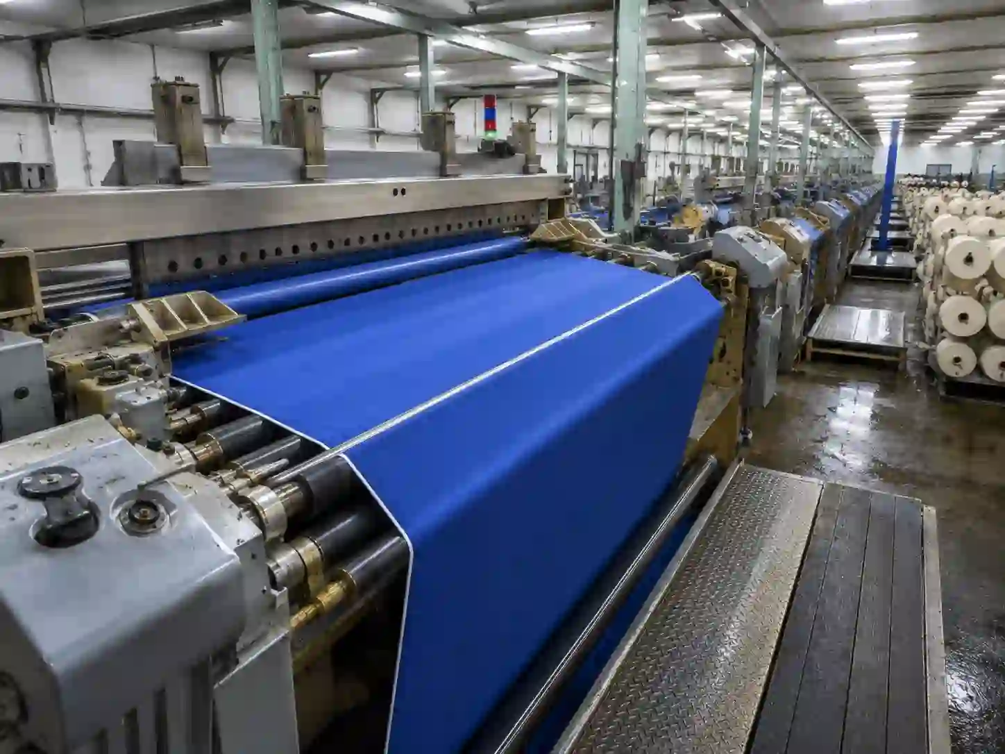 Rubber covered roller for textile processing equipment