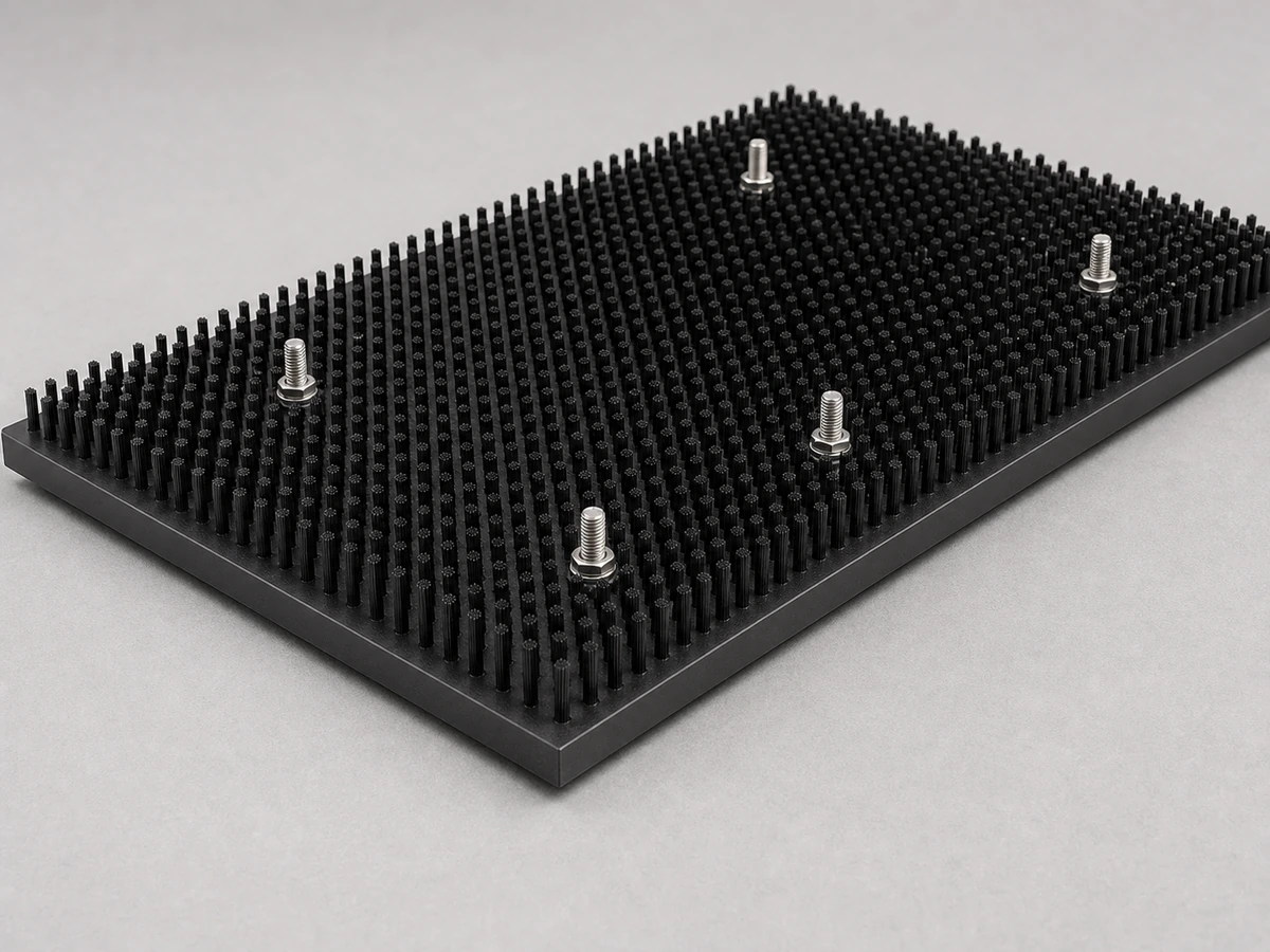 Fixed mounted panel brush on a flat base for stable surface contact on industrial equipment