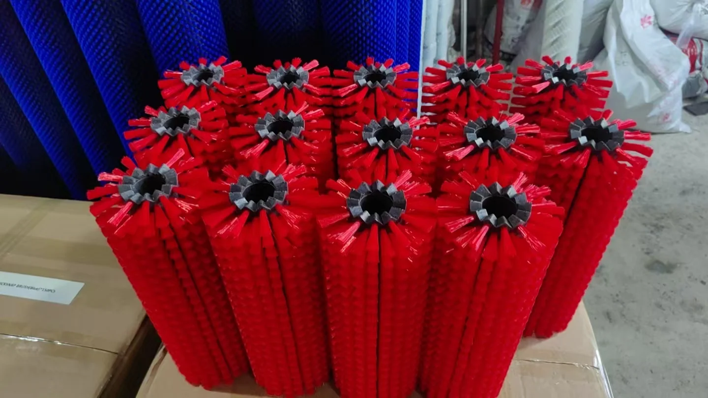 Completed zig-zag brush segments with red bristles and black toothed bodies arranged before packing