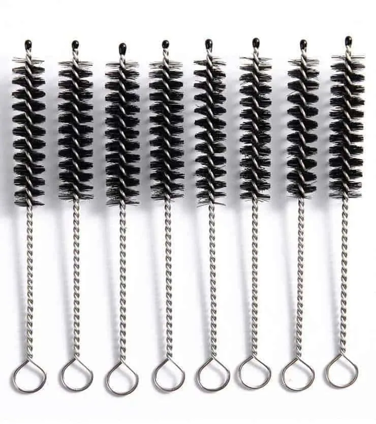 Tube and bottle brushes for cleaning narrow food processing nozzles