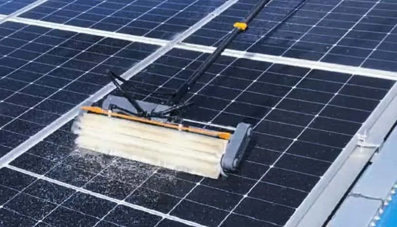 Automatic solar panel cleaning brushes maintaining output on a commercial photovoltaic array