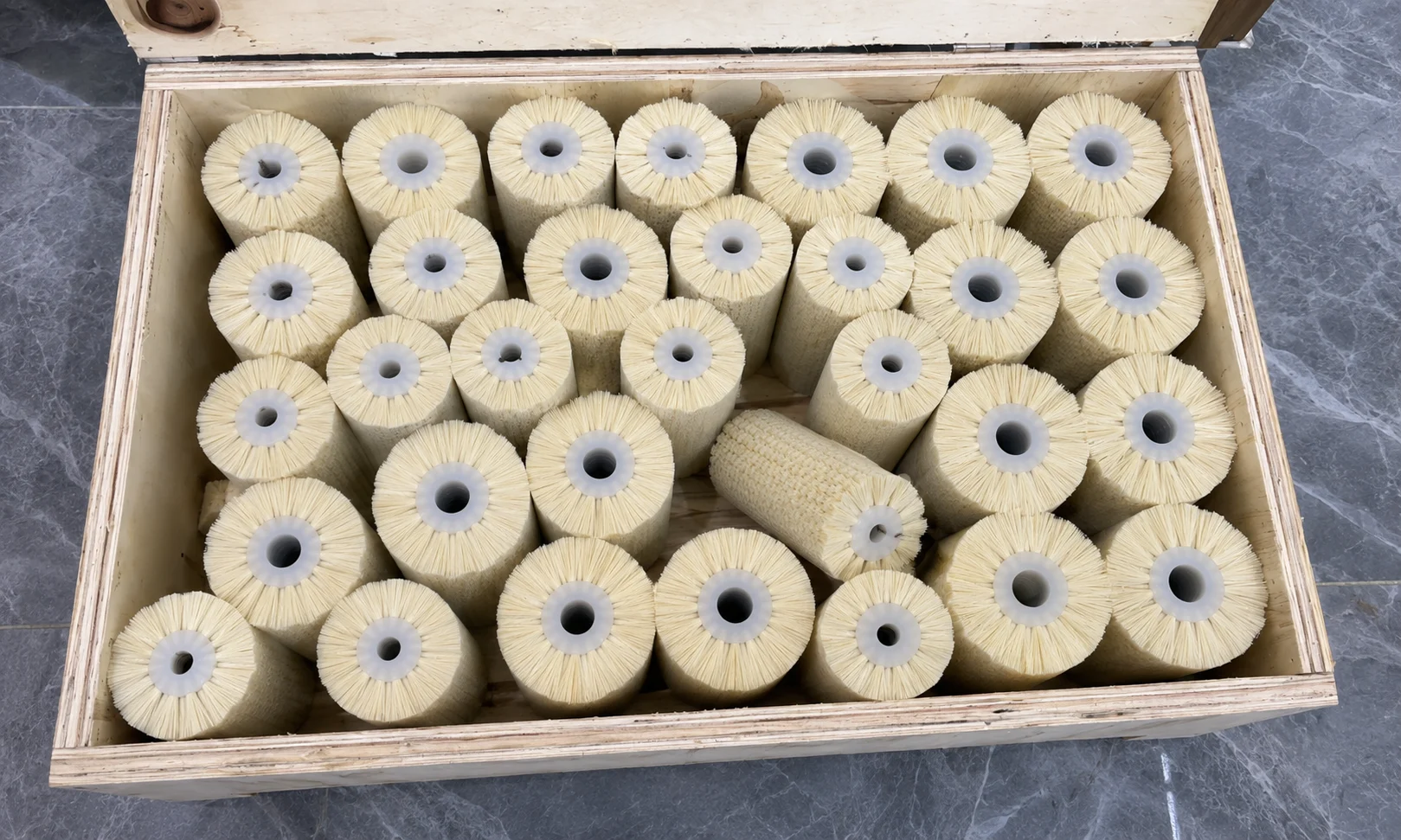 Cylinder brush order secured in a wooden shipping case