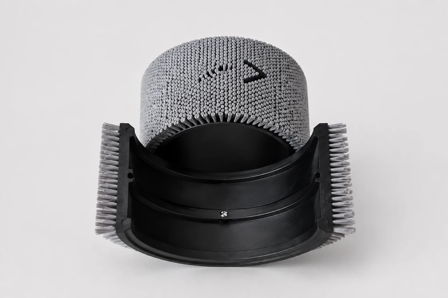 Split-core two-piece roller brush opened for installation around an existing shaft