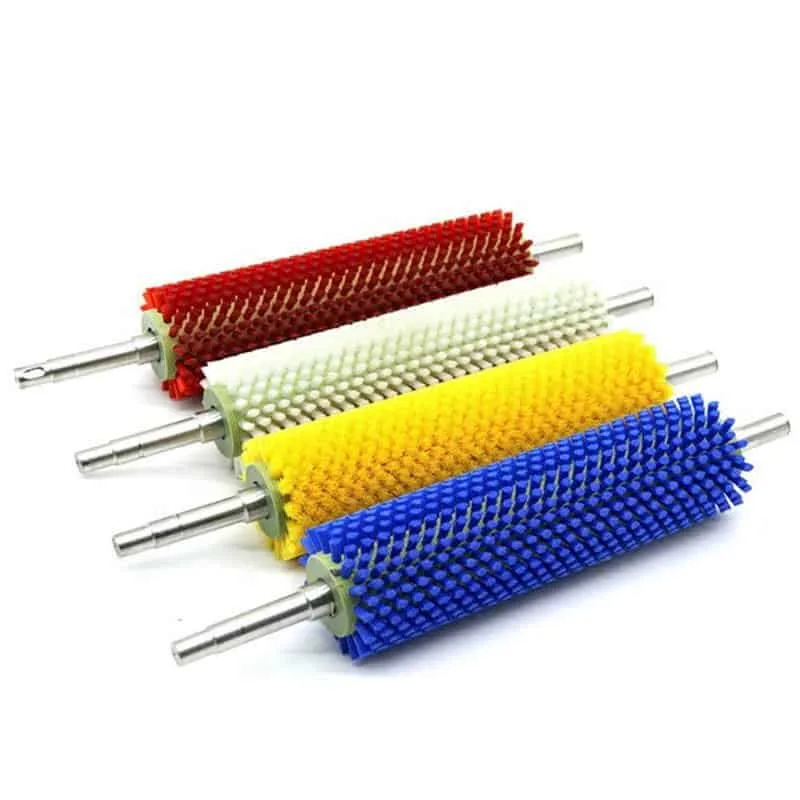 Tufted industrial roller brushes with shafts on white background