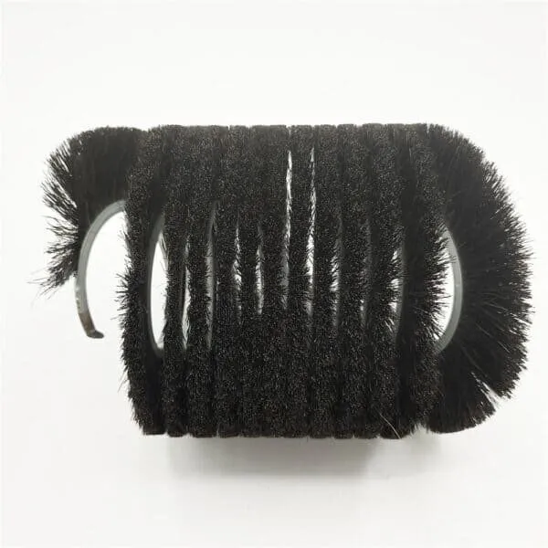 Spiral brush wound around a metal core for continuous contact on industrial equipment