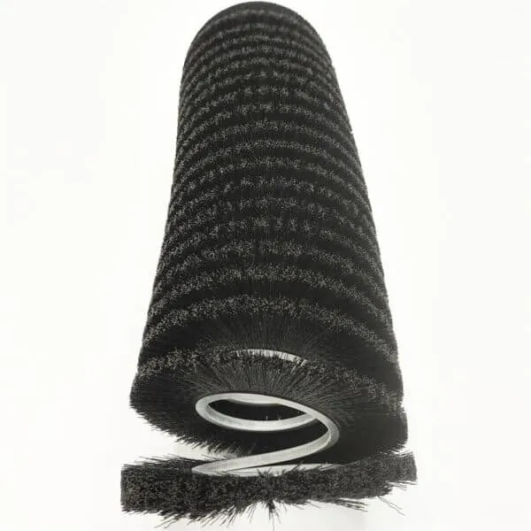 Open-wound coil brush with visible spacing between helical rows for lighter continuous contact