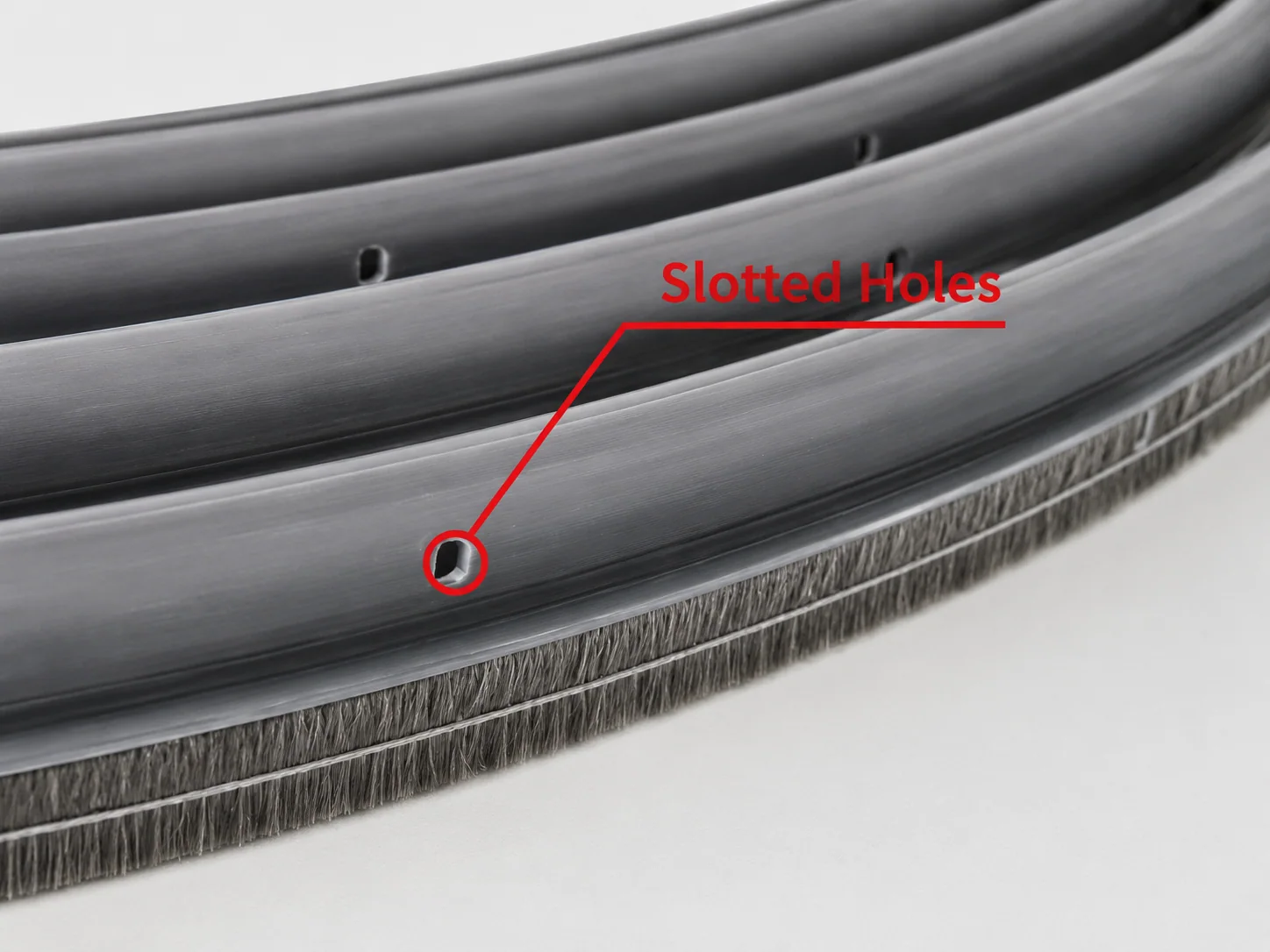 Slotted mounting holes in a rotary heat exchanger seal brush base