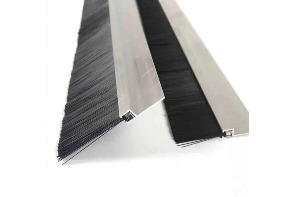 Nylon strip brush with black filament fill and metal backing