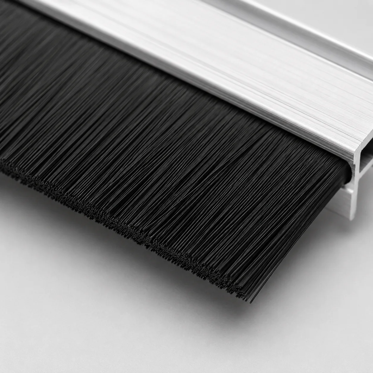 Carbon-fiber filament for static-control strip brush assemblies