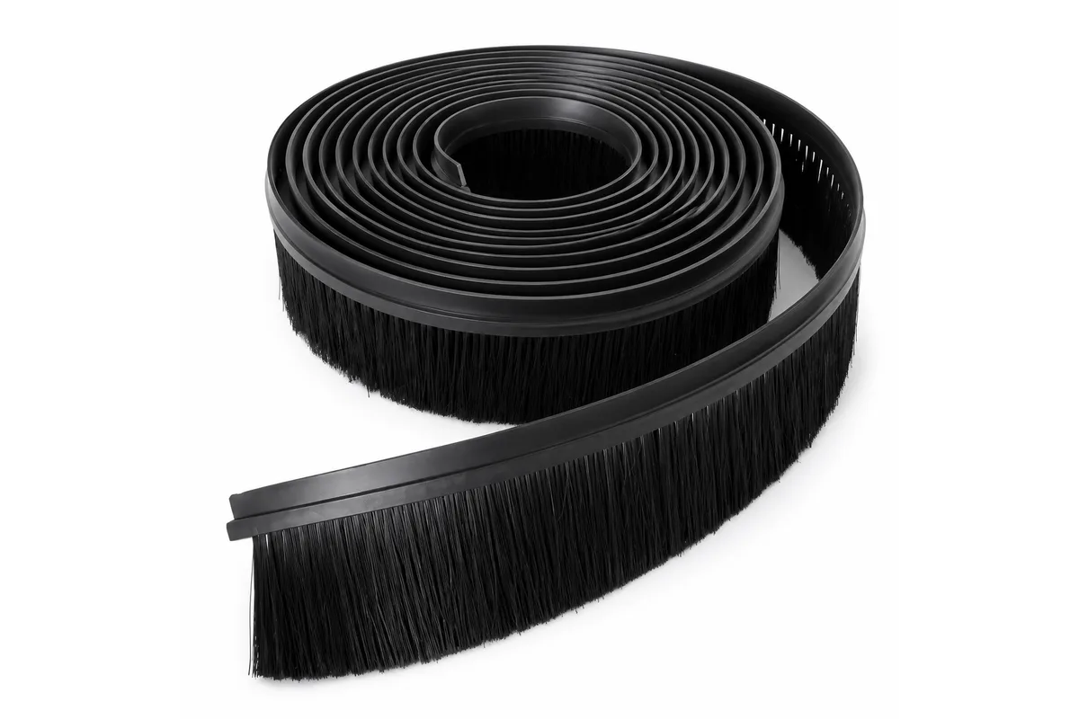 Flexible coiled strip brush with black backing and dense black fill
