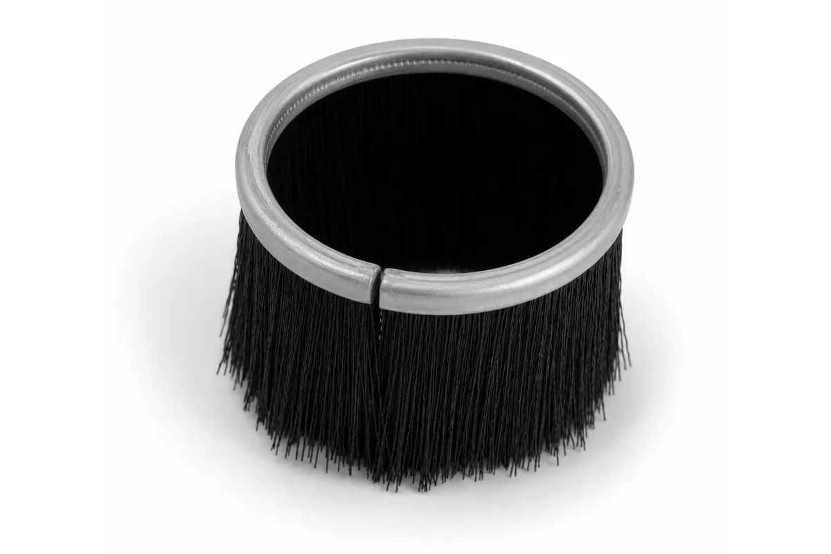 Formed circular strip brush with metal backing and black fill