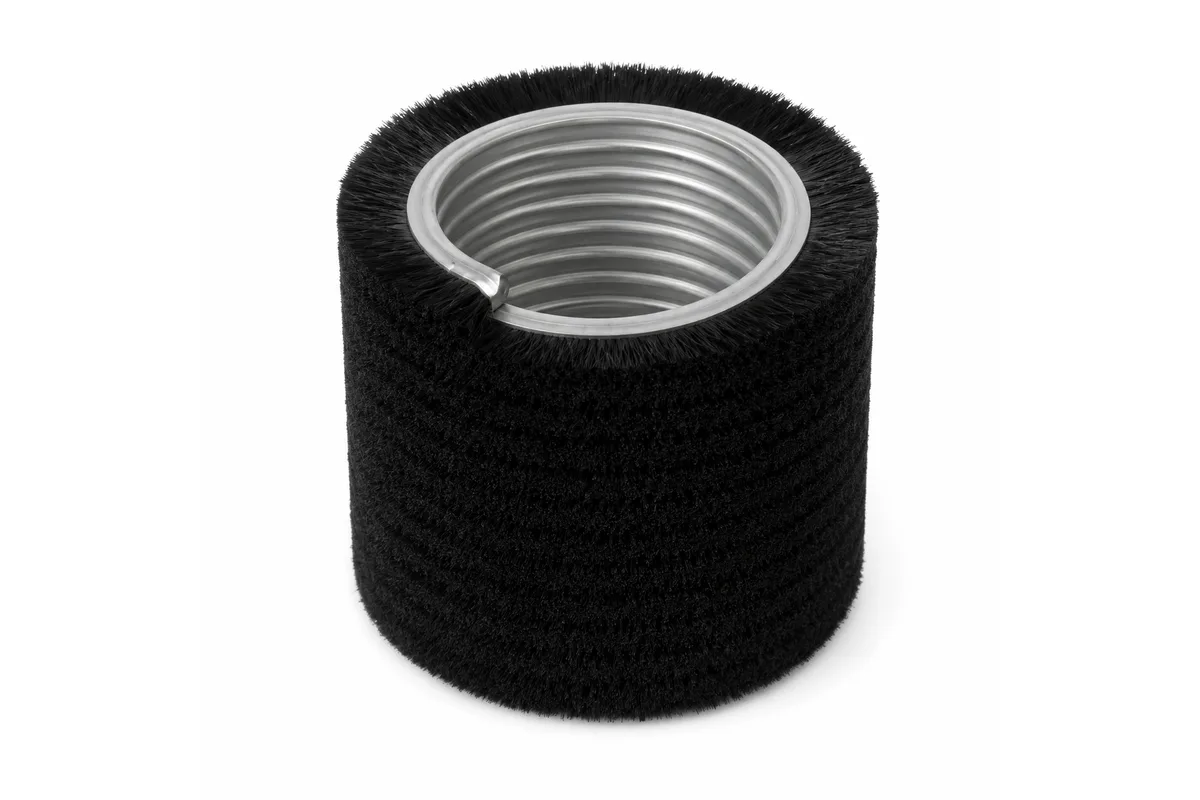 Spiral wound strip brush assembly around a cylindrical core