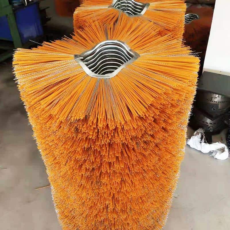 Close-up of orange sweeper brush fill showing dense bristles around the core