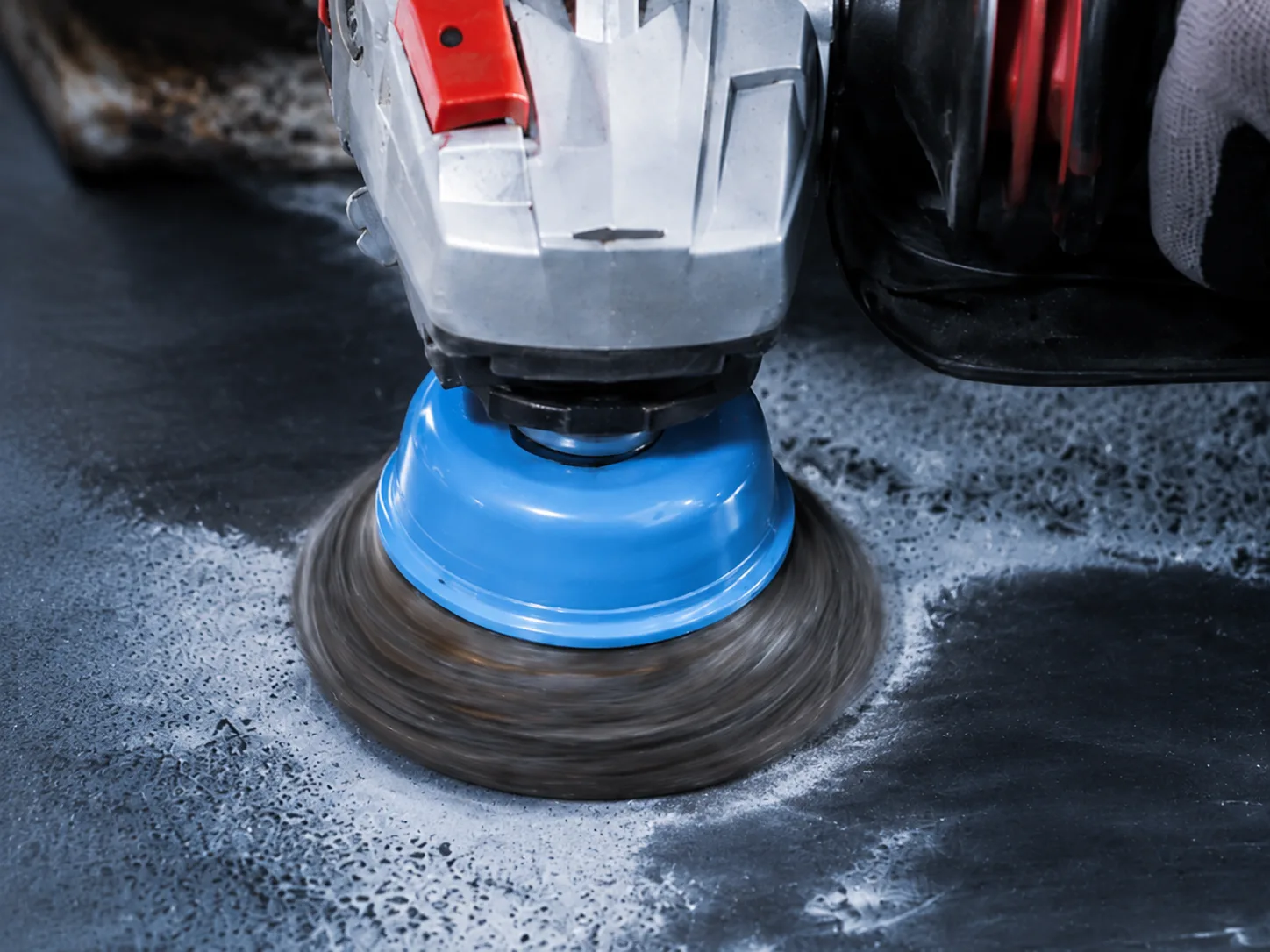 Wire cup brush removing paint and coating residue